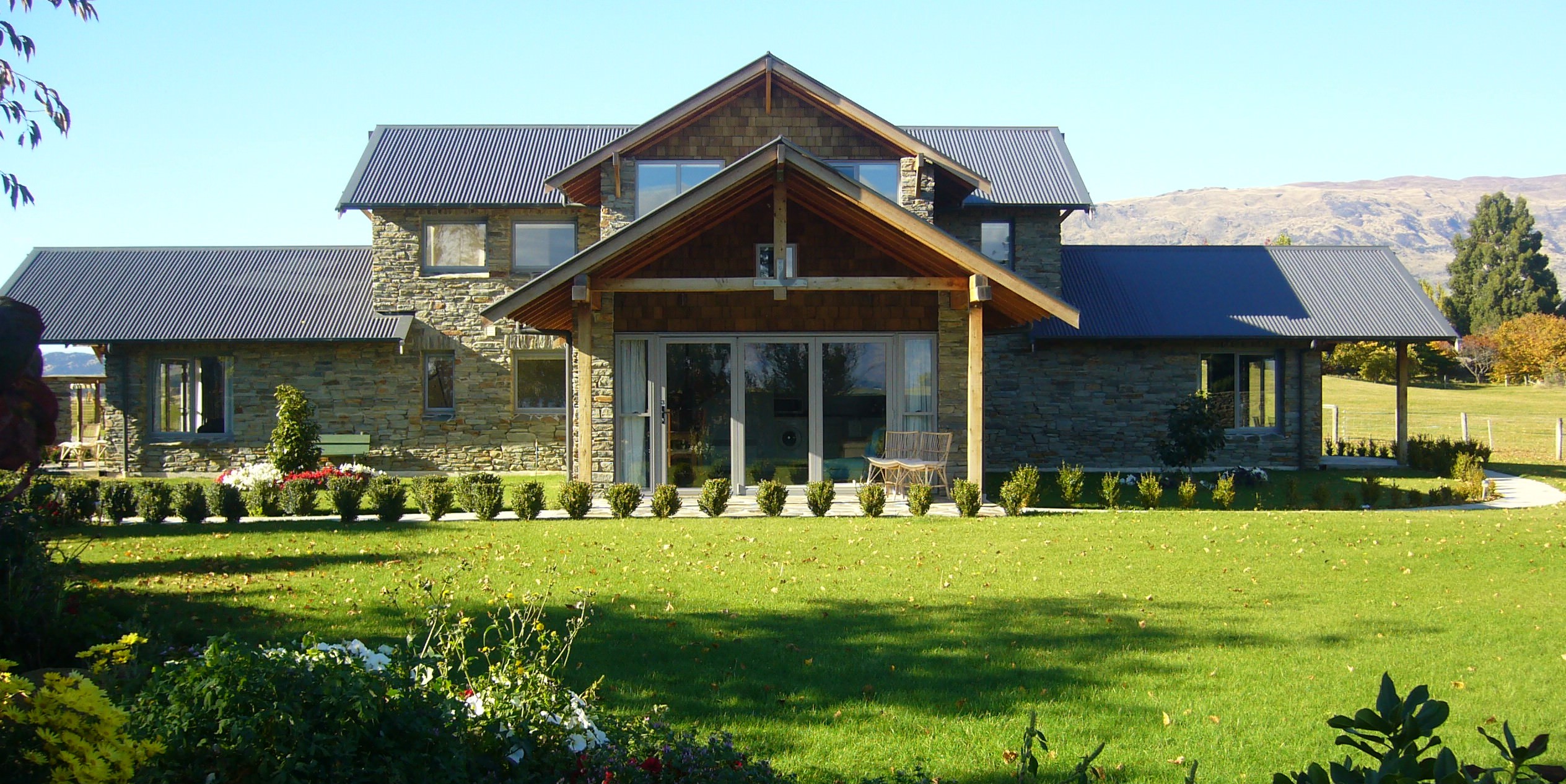 The chalets at Golf Course Road with the Southern Alps rising behind them