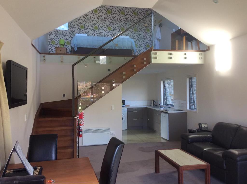 The split-level One Bedroom Chalet, with views over the mountains, lake and gardens