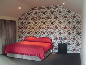 The Two Bedroom Chalet with Spa Bath, showing the spa bath and full kitchen